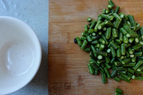 chopped snake beans and white bowl